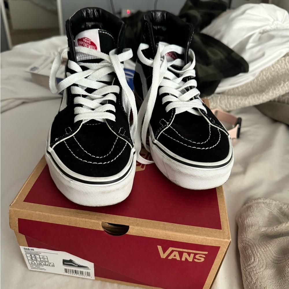 Black and white high top vans